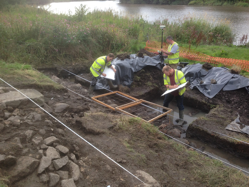 GUARD Archaeologists recording the medieval harbour 